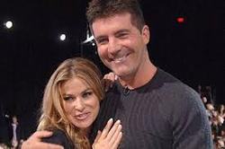 Simon Cowell has confirmed he is dating Carmen Electra