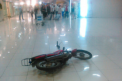 Drunk biker entered the airport through the glass