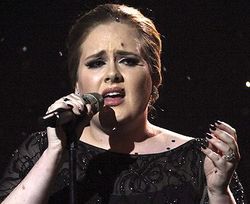 Adele gets stomach cramps on the red carpet