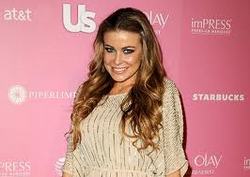 Carmen Electra is "yearning" for a baby