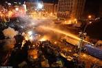 Unidentified tore down the tents of protesters on the Maidan in Kiev
