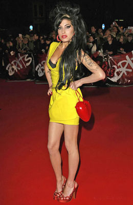 Amy Winehouse hospitalised after  "leaking" of her breast implants