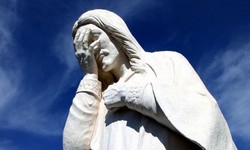 The priest broke the sculpture of Jesus Christ