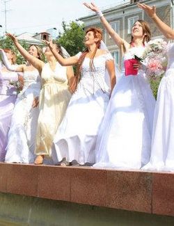 Latvian city holds parade of brides
