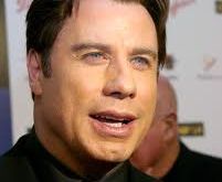 Masseur drops charges against John Travolta