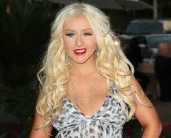 Christina Aguilera hopes her curvy figure will "empower" women