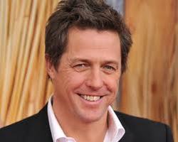 Hugh Grant likes his baby daughter "very much"