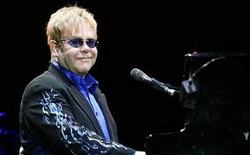 Sir Elton John is "doing extremely well" from a respiratory infection