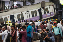 In India, two trains crashed off a bridge