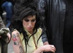 Amy Winehouse arrested on suspicion of drugs possession